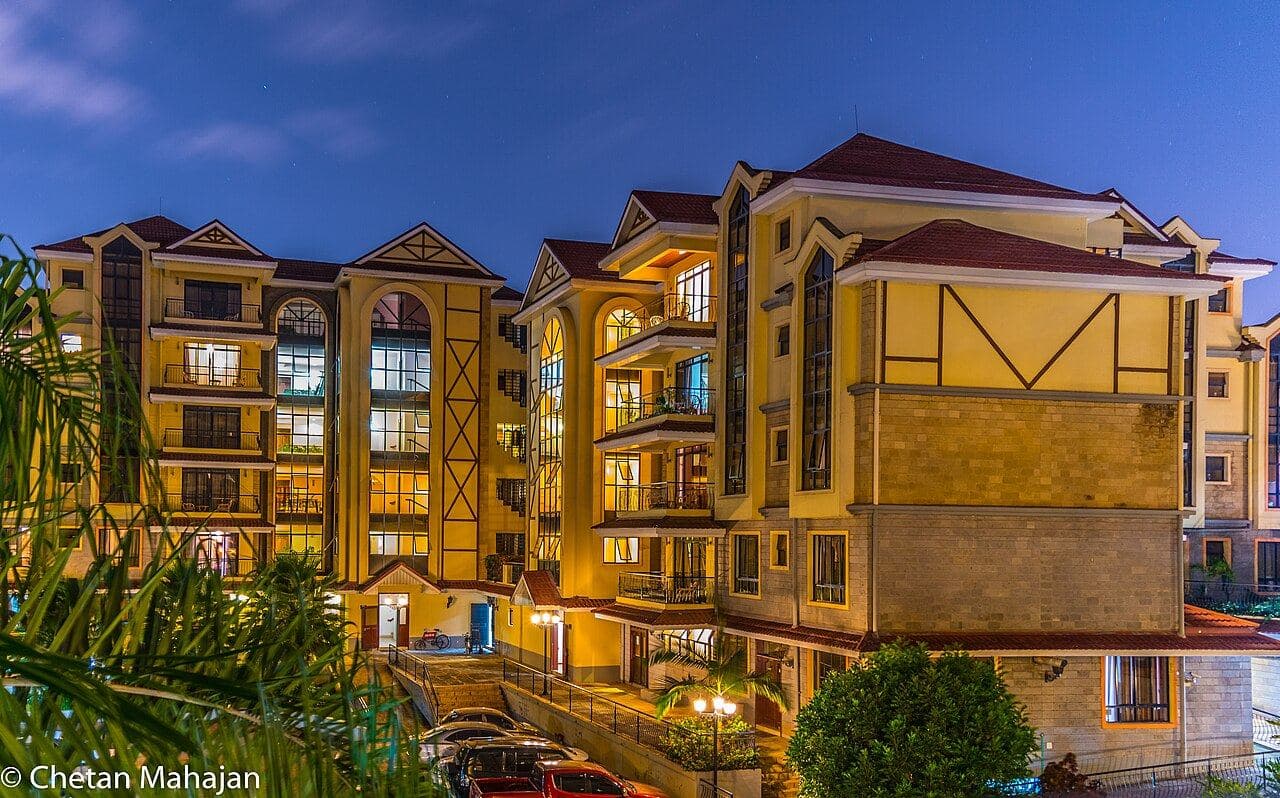 Apartment blocks lit up at dusk